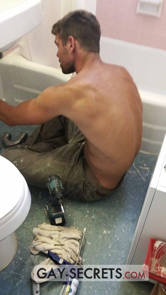 Sexy shirtless plumber photographed by a gay voyeur